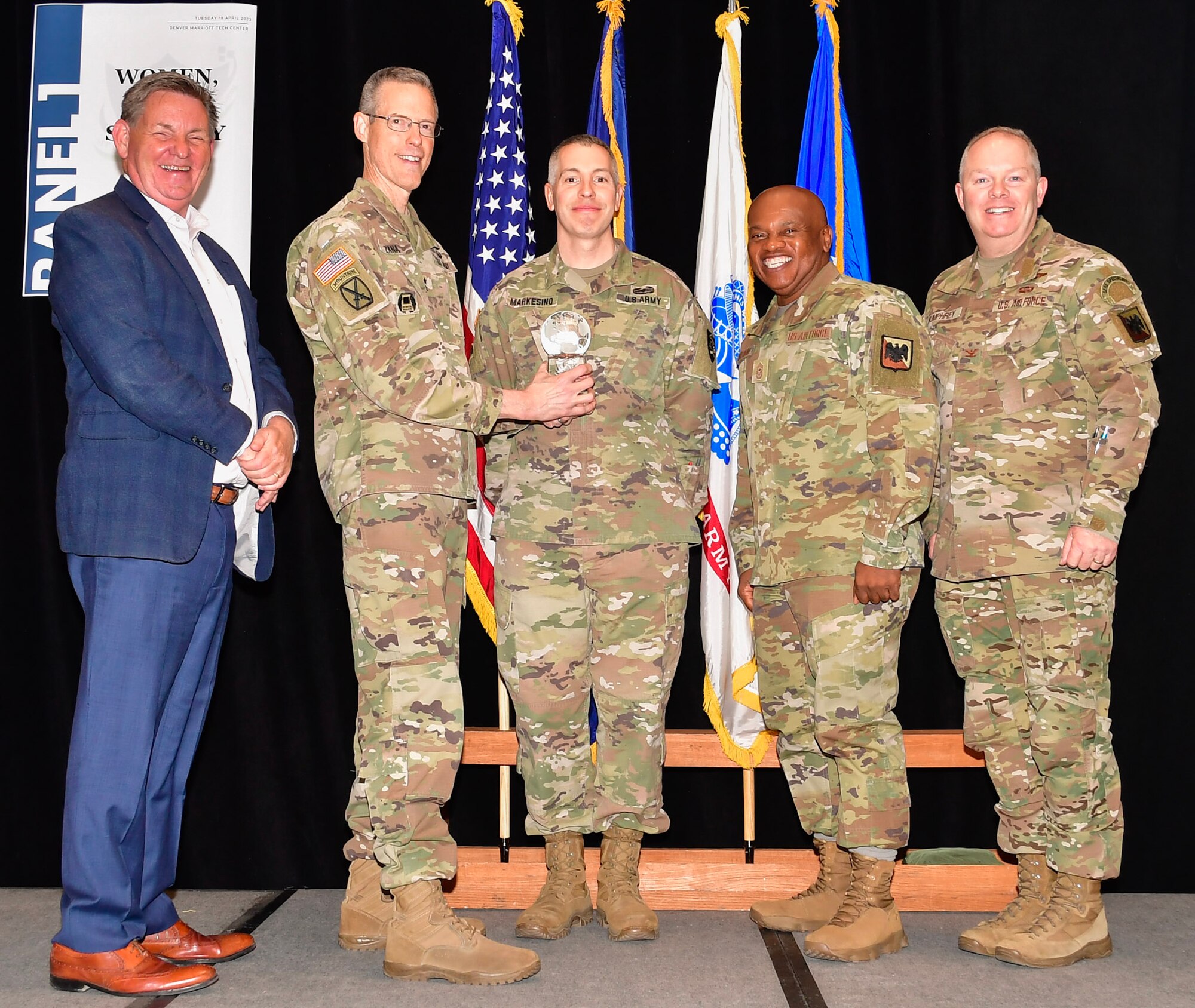 Left to right, Ambassador Dennis Hankins, foreign policy advisor to the National Guard Bureau; Maj. Gen. William Zana, director of Strategic Plans and Policy and International Affairs for NGB; Lt. Col. Christopher Markesino from the Oregon National Guard; Senior Enlisted Advisor Tony Whitehead, SEA to the chief, National Guard Bureau; and Col. Scott Humphrey, chief of the National Guard Bureau International Affairs Division, during an awards presentation at the annual State Partnership Program conference April 20, 2023.