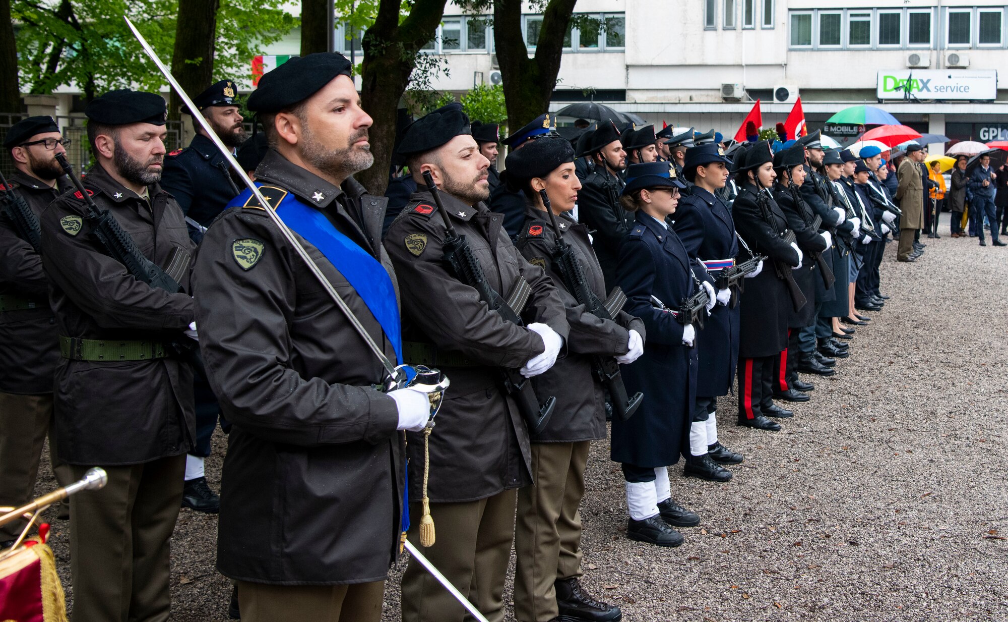 Italian service members stand in formation during a ceremony for Italy’s Liberation Day celebration