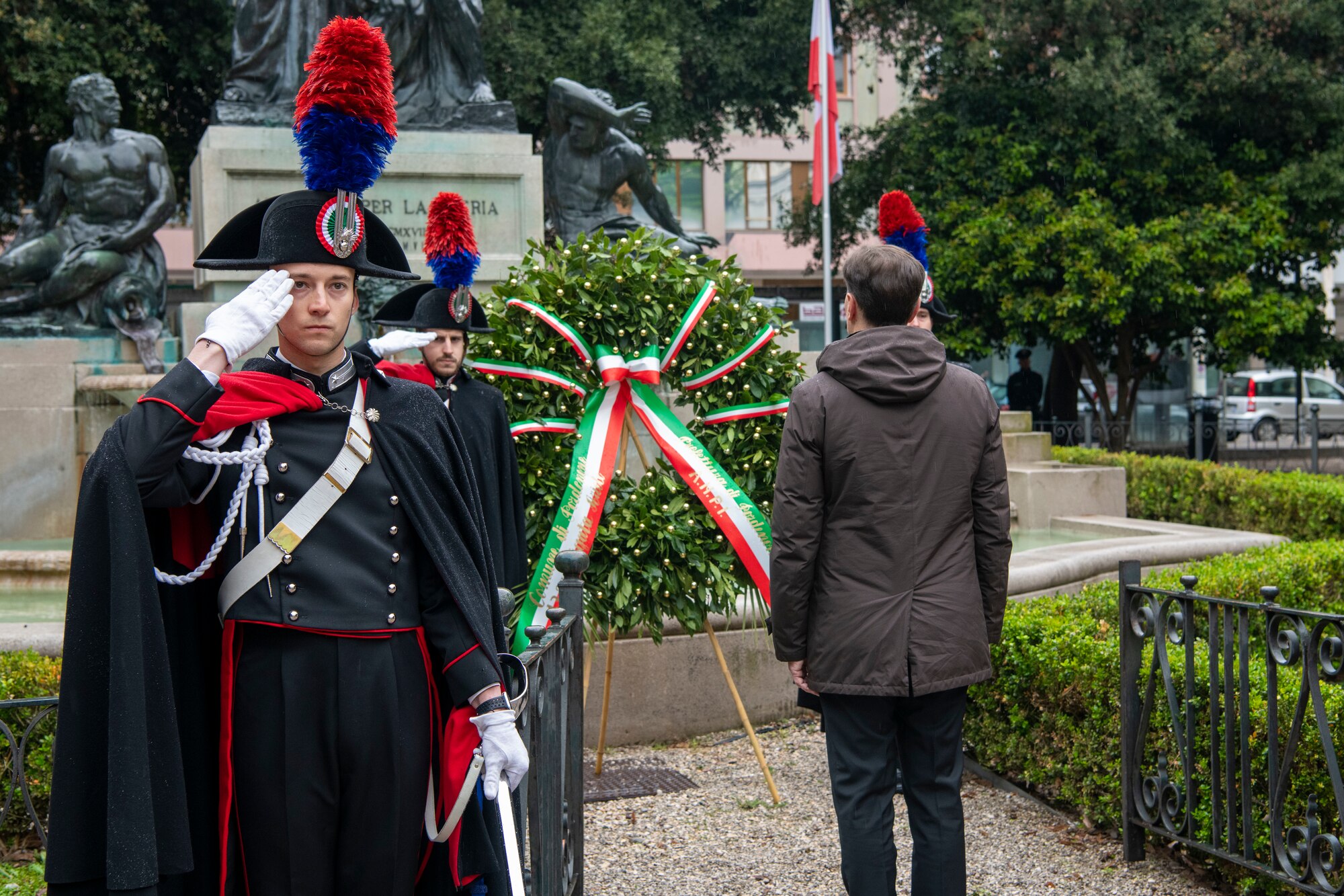 Italian service members lay a wreath during a ceremony for Italy’s Liberation Day celebration