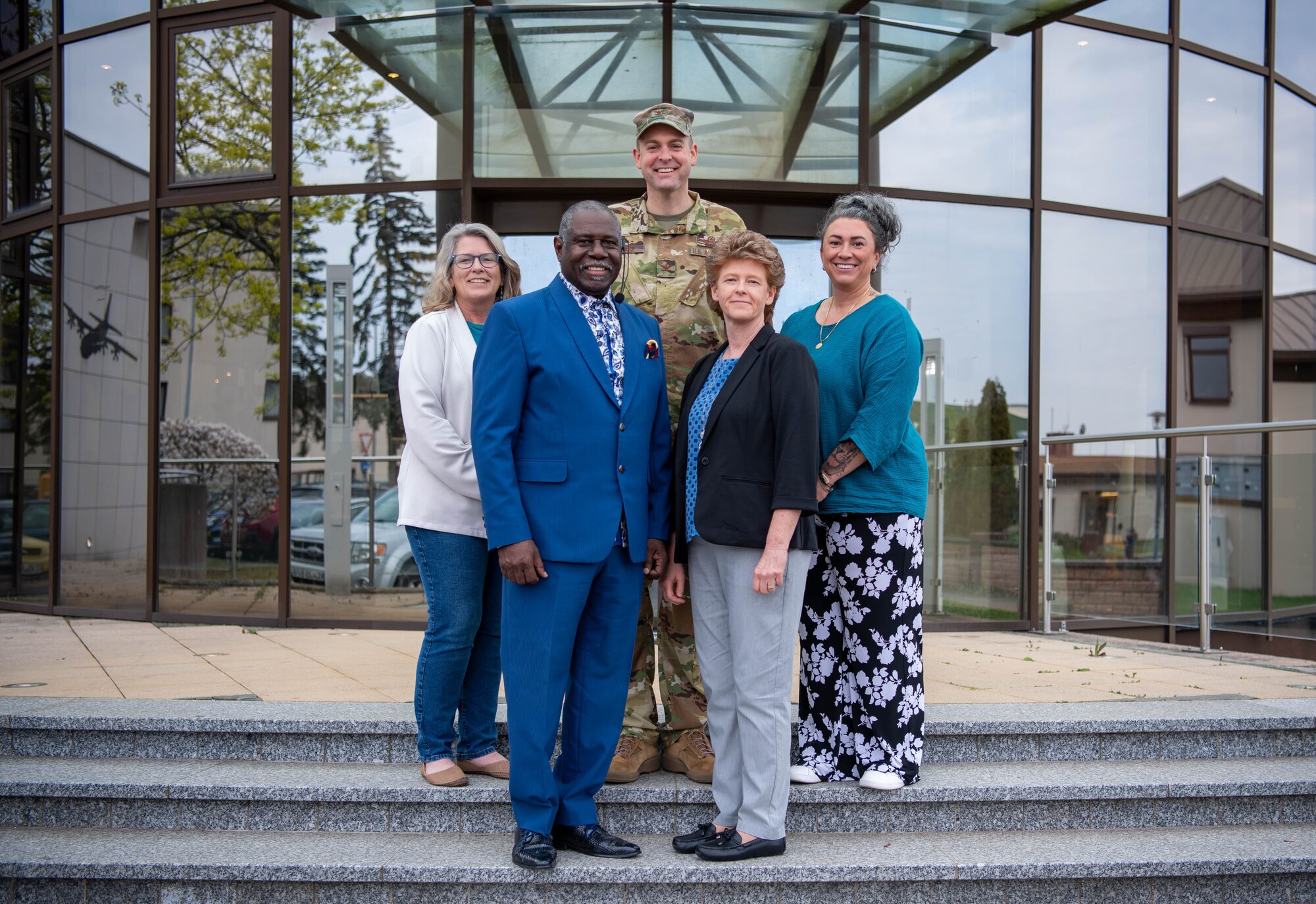 U.S. Air Force Col. Denny R. Davies, 86th Airlift Wing vice commander, poses for a group photo with team representatives of Ramstein Air Base Sexual Assault and Prevention Awareness, and U.S. Army Sexual Harassment/Assault Response and Prevention, and Russell Jordan, risk reduction program coordinator, on April 20, 2023 at Ramstein AB, Germany.