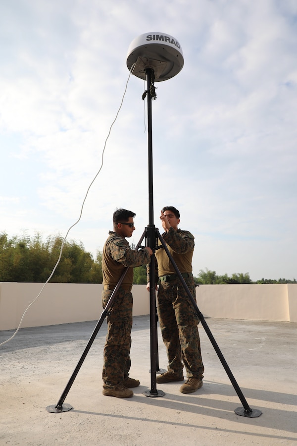 U.S. Marine Corps Sgt. Francisco Hernandez, left, a surveillance sensor operator, and Sgt. Luis Cortes, a meteorology and oceanology forecaster, both assigned to the 13th Marine Expeditionary Unit, assemble a SIMRAD Halo-24 radar during Exercise Balikatan 23 in Antique, Philippines, April 14, 2023. Balikatan is an annual exercise between the Armed Forces of the Philippines and U.S. Military designed to strengthen bilateral interoperability, capabilities, trust, and cooperation built over decades of shared experiences. (U.S. Marine Corps photo by Cpl. Quince D. Bisard)