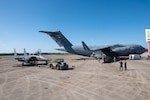 A U.S. Air Force F-15E Strike Eagle aircraft is connected to a C-17 Globemaster III aircraft for aircraft-to-aircraft refueling operations, one of the many agile combat employment strategies being tested at Exercise Southern Strike at Gulfport Combat Readiness Training Center, Gulfport, Mississippi, April 20, 2023. The large-scale, joint and international combat exercise features agile combat employment, counterinsurgency, close air support, non-combatant evacuations, and maritime special operations.