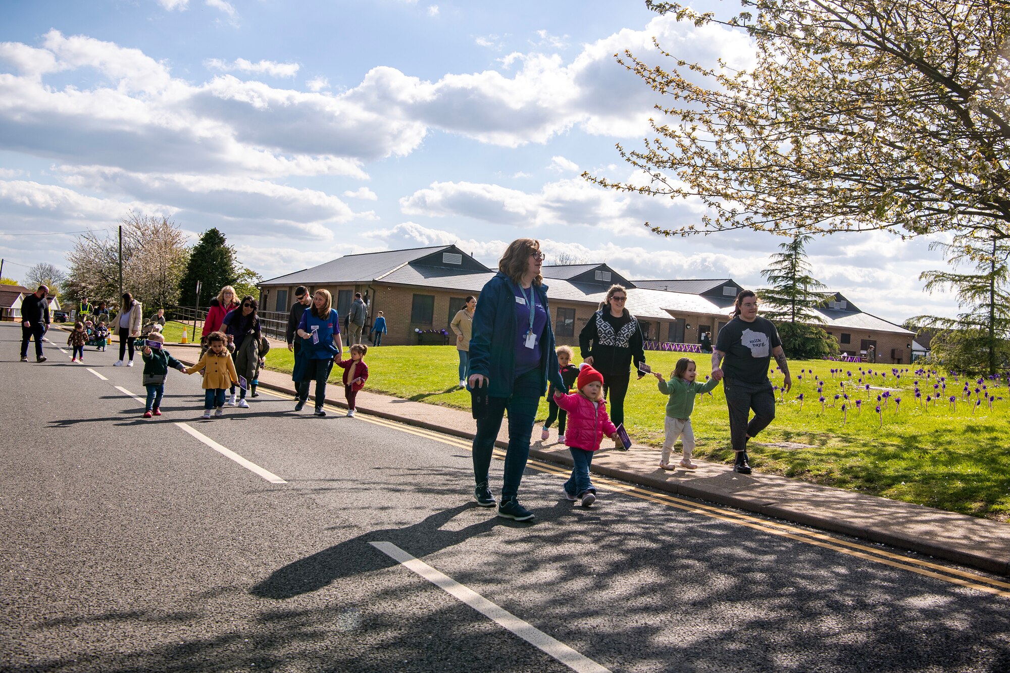 Children walk in a Month of the Military Child Parade at RAF Alconbury, England, April 25, 2023. The parade was held to show gratitude for the sacrifices that come with being a military child. (U.S. Air Force photo by Staff Sgt. Eugene Oliver)