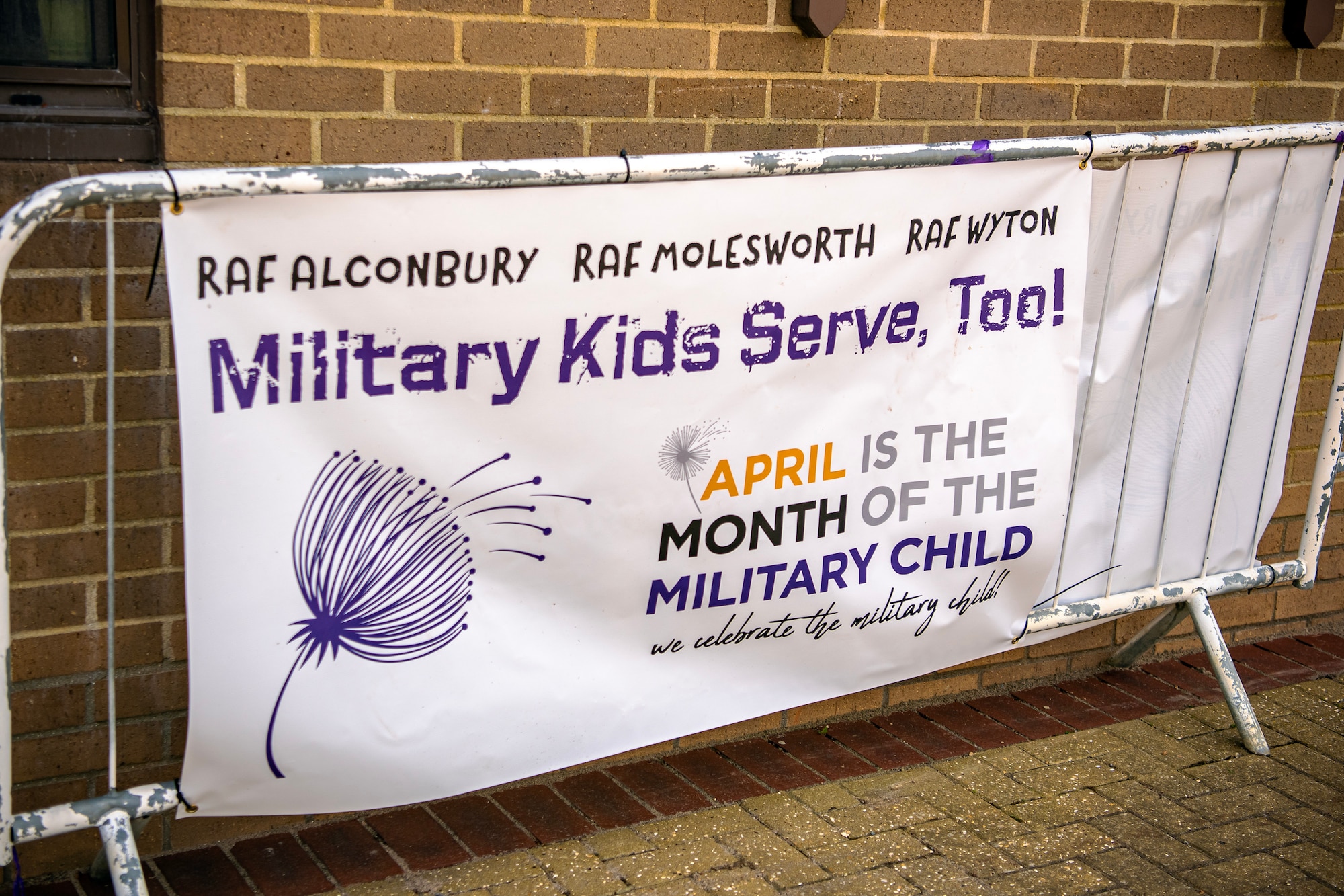 A Month of the Military Child sign is on display in front of the Child Development Center (CDC) at RAF Alconbury, England, April 25, 2023. RAF Alconbury recently held a Month of the Military Child Parade to show gratitude for the sacrifices that come with being a military child. (U.S. Air Force photo by Staff Sgt. Eugene Oliver)