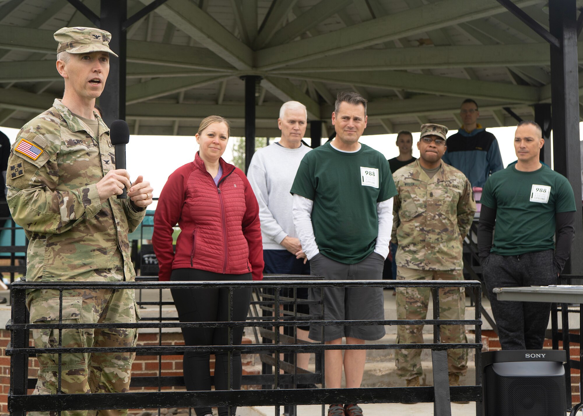 U.S. Army Col. Michael Sapp, Fort George G. Meade garrison commander, provides opening remarks during a Suicide Awareness Walk with Airmen assigned to the 70th Intelligence, Surveillance and Reconnaissance Wing, April 21, 2023, at Fort Meade, Maryland. Sapp shared personal experiences and emphasized Fort Meade personnel joining together as a community in raising awareness on suicide prevention, remembering those who were lost to suicide, provide resources, and build connections with one another. (U.S. Air Force photo by Staff Sgt. Kevin Iinuma)