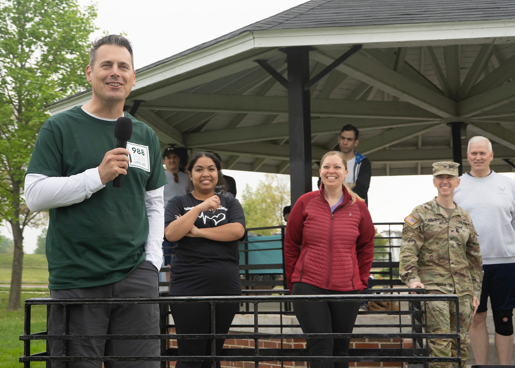 U.S. Air Force Col. Craig Miller, 70th Intelligence, Surveillance and Reconnaissance Wing commander, provides remarks during a Suicide Awareness Walk, April 21, 2023, at Fort George G. Meade, Maryland. Miller welcomed the participants to come together as a community in raising awareness on suicide prevention and pledge their support to resiliency, honoring the friends and battle buddies lost, and gaining the tools and resources necessary to support one another. (U.S. Air Force photo by Staff Sgt. Kevin Iinuma)