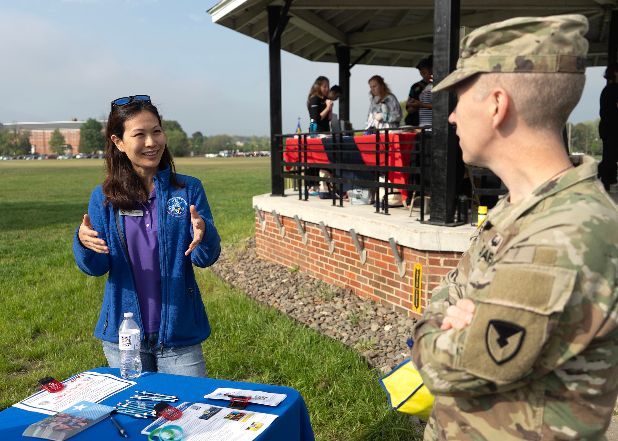 U.S. Air Force Master Sgt. Li Rivera, 707th Force Support Squadron noncommissioned officer in charge of readiness, speaks with U.S. Army Col. Michael Sapp, Fort George G. Meade garrison commander, during a Suicide Awareness Walk, April 21, 2023, at Fort Meade, Maryland. Rivera informed Sapp of the helping agencies that are available to the Fort Meade community to care for one another, build resiliency, increase morale and raise suicide prevention awareness. (U.S. Air Force photo by Staff Sgt. Kevin Iinuma)