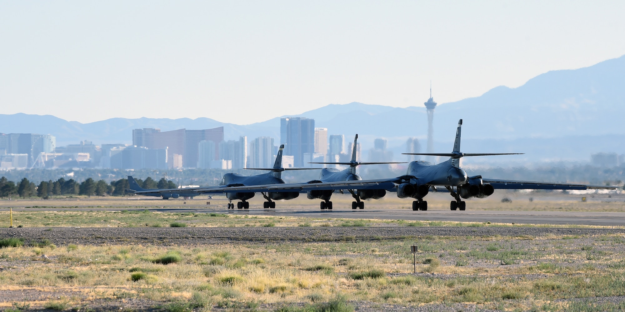 Three B-1B Lancers taxi down the runway at Nellis Air Force Base, Nev., June 14, 2017. Airmen assigned to the 337th Test and Evaluation Squadron spent time at Nellis AFB testing new software for Sustainment Block 17.