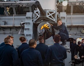 Fire Controlman 2nd Class Justin Kijowski loads ammunition into a close-in weapons systems for a test fire aboard the amphibious assault ship USS Wasp (LHD 1), April 22, 2023.