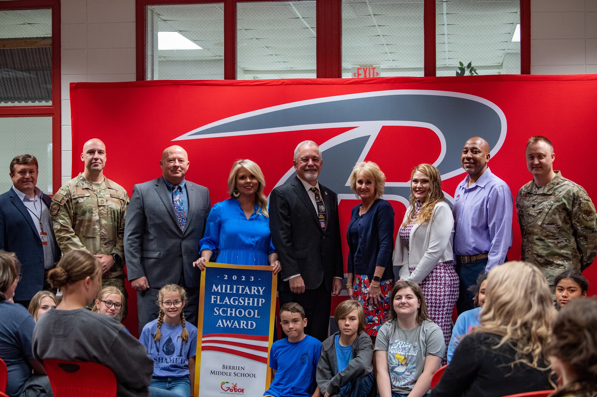 Representatives from Berrien Middle School accept the Military Flagship School Award during an award ceremony in Nashville, Georgia, April 24, 2023. This is the first year that Berrien Middle School has received this award; the faculty and staff value the relationship between the school and Moody Air Force Base, and work hard to provide a great educational experience to students and their families. (U.S. Air Force photo by Senior Airman Courtney Sebastianelli)