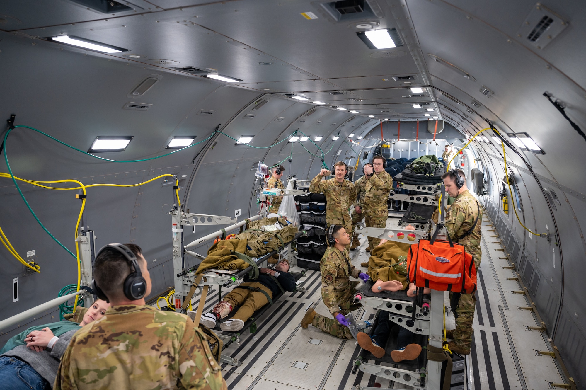 Members from the 375th Aeromedical Evacuation Squadron and 22nd Medical Group practice patient care on a flight in a KC-46A Pegasus during Exercise Lethal Pride March 29, 2023, over Kansas. Lethal Pride was a five-day exercise testing the 22nd Air Refueling Wing’s ability to launch, communicate with and recover aircraft in a contested environment with degraded communications. (U.S. Air Force photo by Senior Airman Zachary Willis)