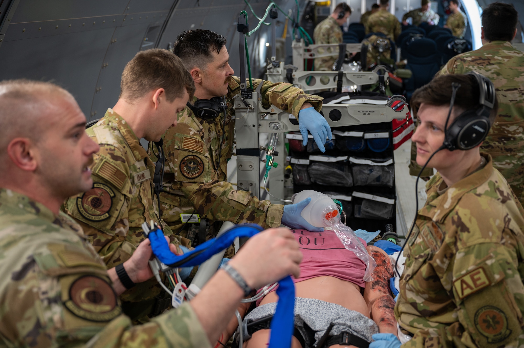 Members from the 375th Aeromedical Evacuation Squadron practice care on a simulated patient during Exercise Lethal Pride March 29, 2023, at McConnell Air Force Base, Kansas. Lethal Pride was a five-day exercise testing the 22nd Air Refueling Wing’s ability to launch, communicate with and recover aircraft in a contested environment with degraded communications. (U.S. Air Force photo by Senior Airman Zachary Willis)