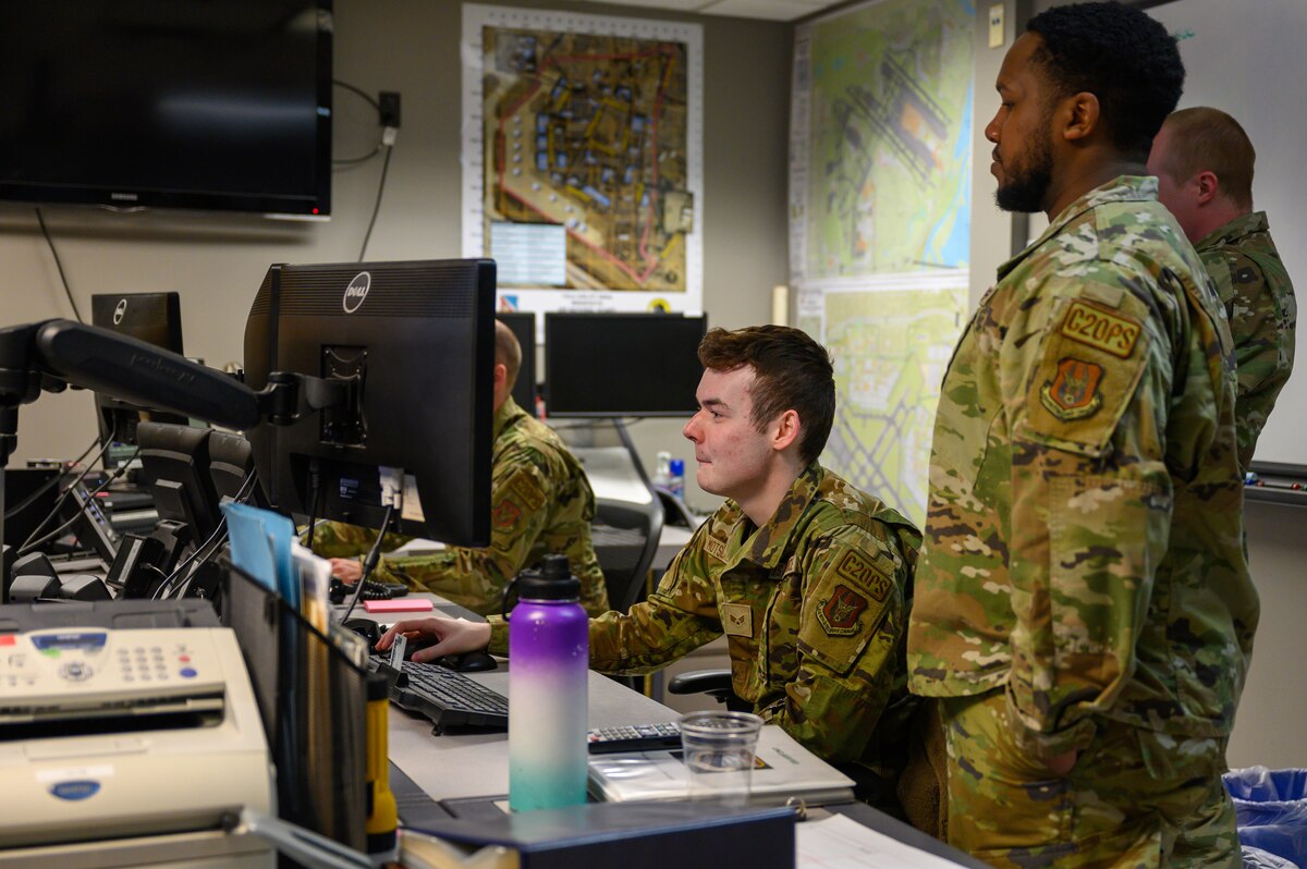 Senior Airman Jake Motschenbacher, 934th Airlift Wing Command Post command post controller, examines incoming information at the Command Post at Joint Air Reserve Station Minneapolis – St. Paul, Minnesota, April 1, 2023. Airmen at the Command Post use software that compiles all local and national news information and alerts them to potential events in their area. (U.S. Air Force photo by Master Sgt. Trevor Saylor)