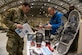 A photo of service members interacting with vendors at a technology expo