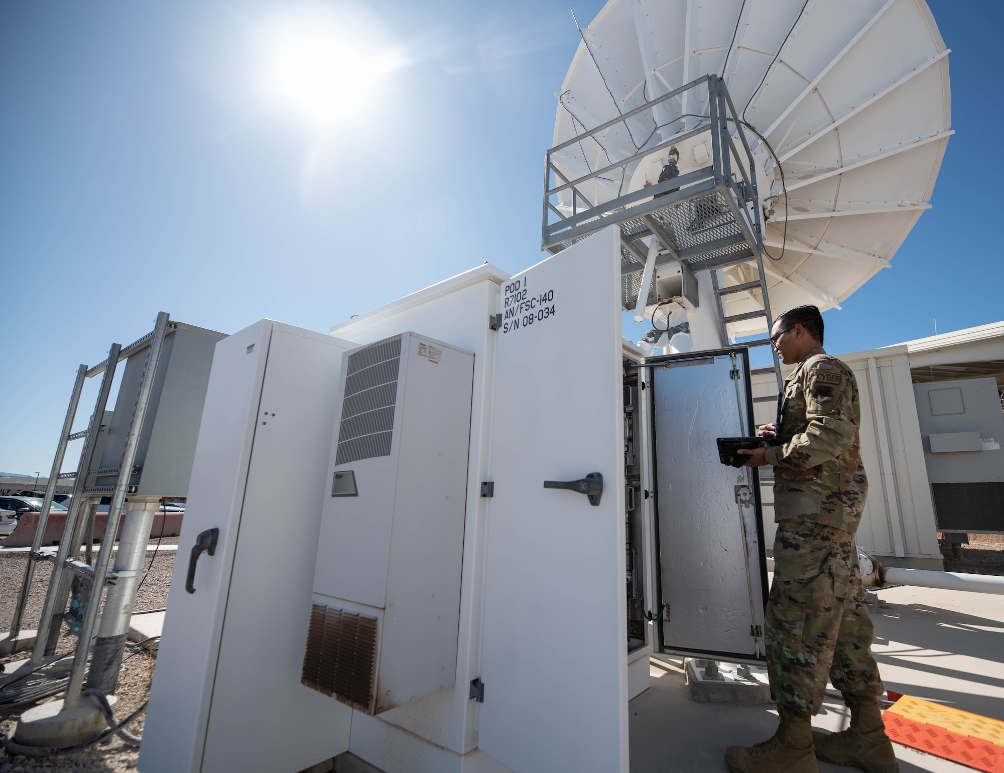 U.S. Air Force Airman 1st Class Thai, 432nd Aircraft Communications Maintenance Squadron fixed site satellite communication (SATCOM) technician, operates on a satellite used for SATCOM satellite launch and recovery (SLR) at Creech Air Force Base, Nevada, March 31, 2023. SATCOM SLR is a new initiative supporting agile combat employment (ACE), ensuring Airmen and aircrew are postured to provide lethal combat power across the spectrum of military operations. (U.S. Air Force photo by Senior Airman Kristal Munguia)