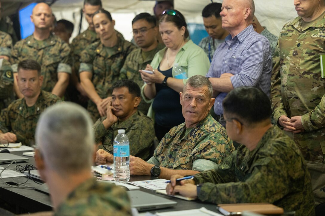 U.S. and Philippine service members gather for a commander update brief during a command post exercise for Balikatan 23 at Camp Aguinaldo, Philippines, April 21, 2023.