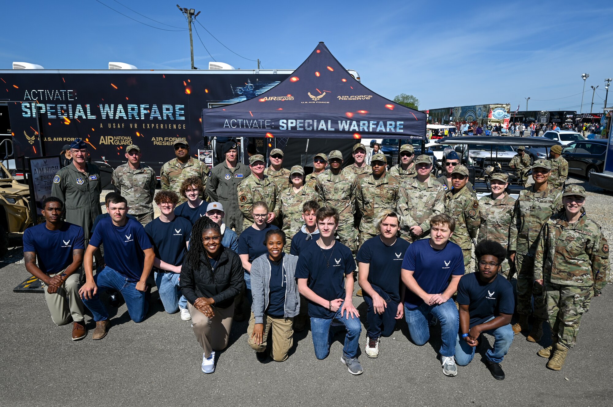 Leadership and recruiters with Air Force Reserve Command and Air Force Recruiting Service pose with members of the delayed entry program prior to taking their Oath of Enlistment.