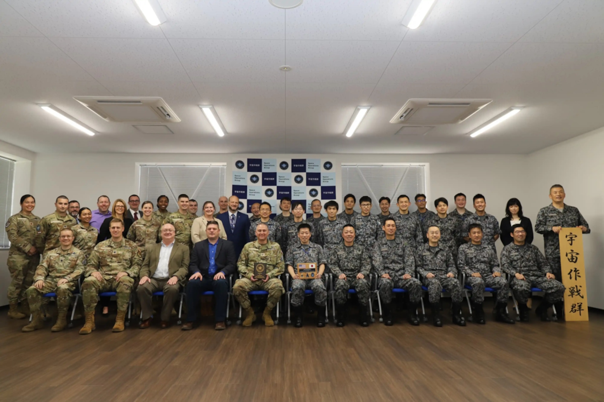 U.S. military representatives from U.S. Space Command, Space Systems Command, Delta 2 and the 18th Space Defense Squadron post for a photo with member from the Japan Air Self-Defense Force’s Space Operations Group at Fuchu Air Base, Japan, April 12, 2023. During the visit, participants discussed how they can implement best practices and lessons learned to further Space Domain Awareness data sharing and operational interoperability. (Courtesy photo)