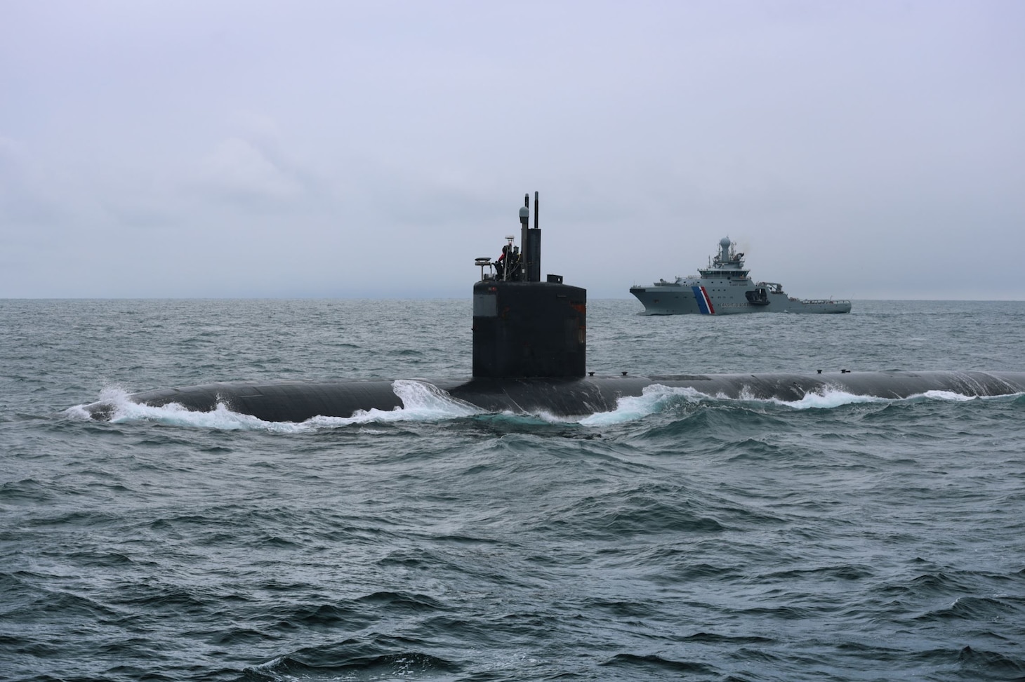 USS San Juan (SSN 751) conducts a brief stop for supplies and personnel off the coast of Iceland, supported by Icelandic Coast Guard ICVG Þór, April 26, 2023.