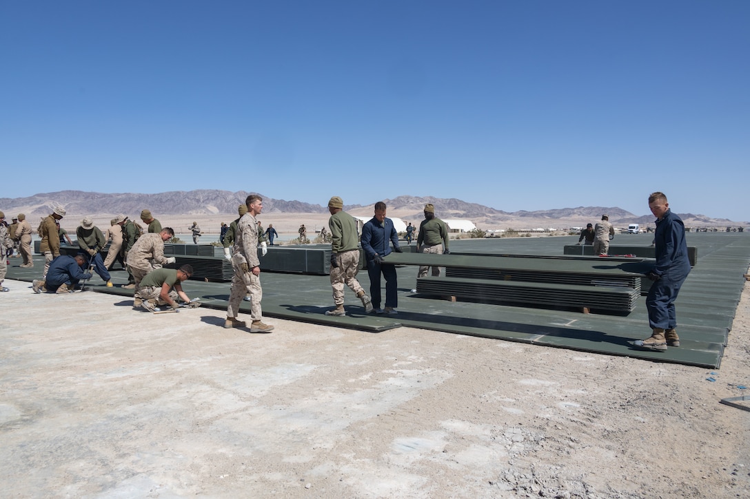 US Marines lay down the first Prefabricated Surfaced Aluminum Flat Top Reinforced Trackway