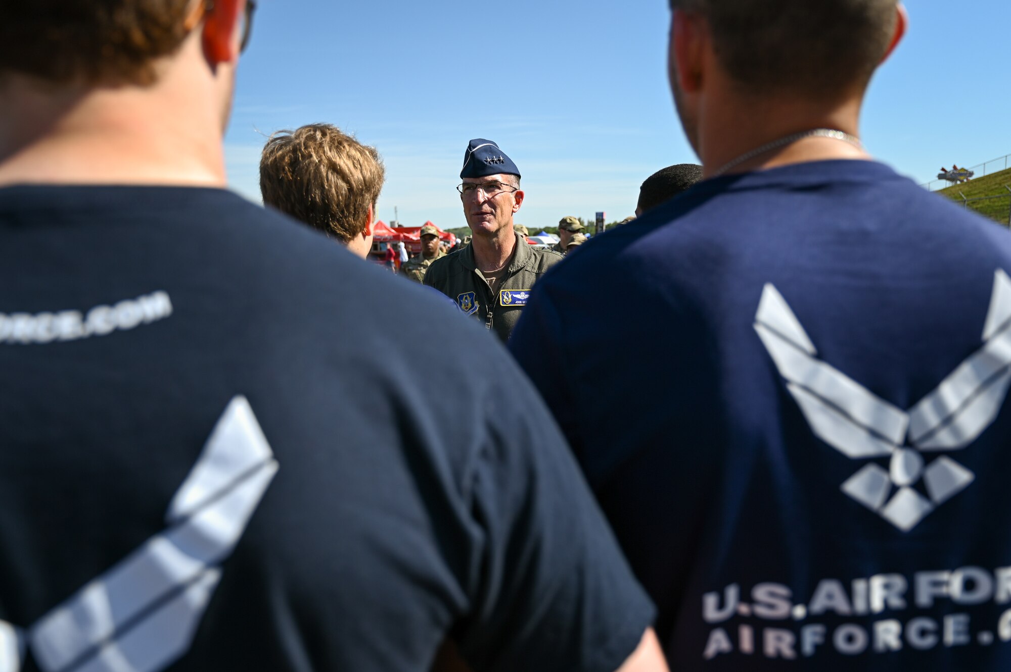 Lt. Gen. John P. Healy, chief of Air Force Reserve and commander, Air Force Reserve Command, engages with members of the delayed entry program.