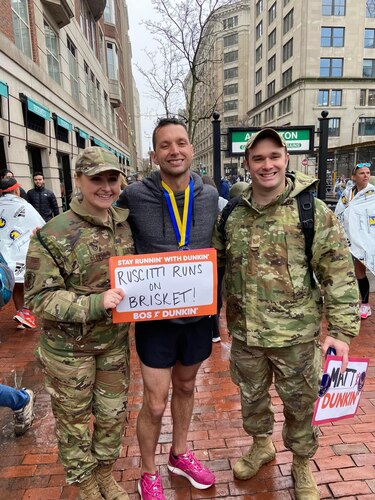 Image of Boston Marathon runner with Airmen