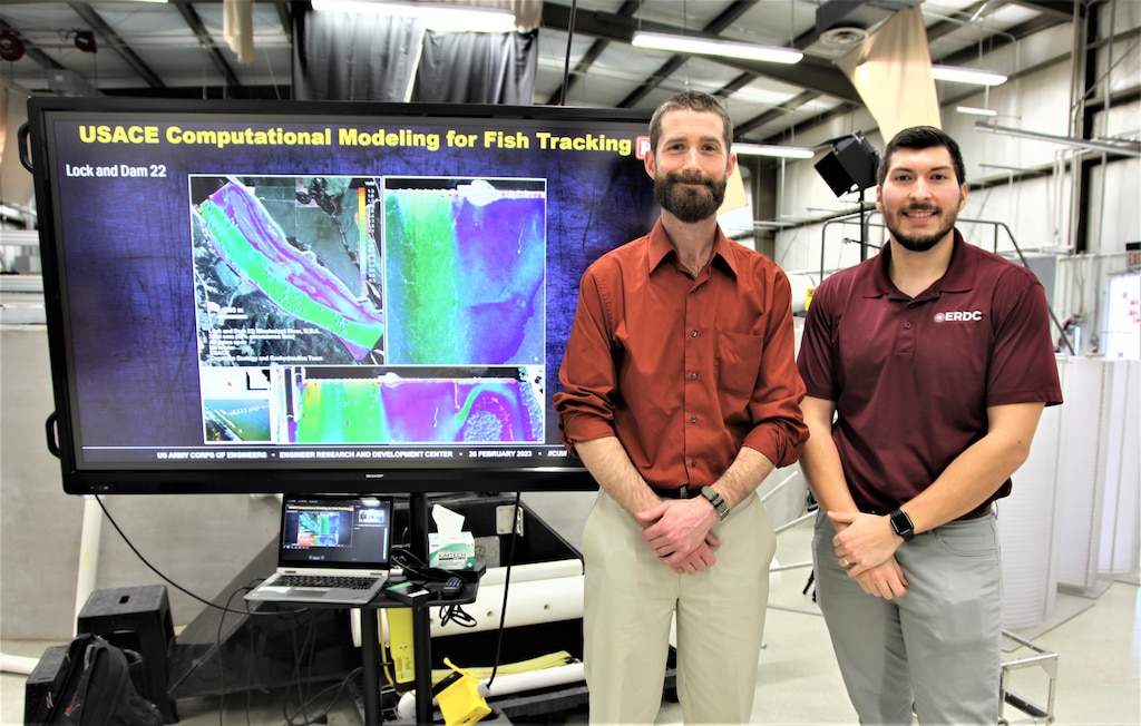 During his orientation tour of four U.S. Army Engineer Research and Development Center laboratories, Portland District’s Dr. Kyle Tidwell, left, visited the Environmental Laboratory’s (EL) Cognitive Ecology Ecohydraulics Research Facility for a briefing by the lab’s Avery Schemmel, research engineer, right, on Computational Modeling for Fish Tracking. Tidwell’s ERDC-U project of researching how civil work programs can support endangered salmon recovery in the Columbia River is based at this EL facility.