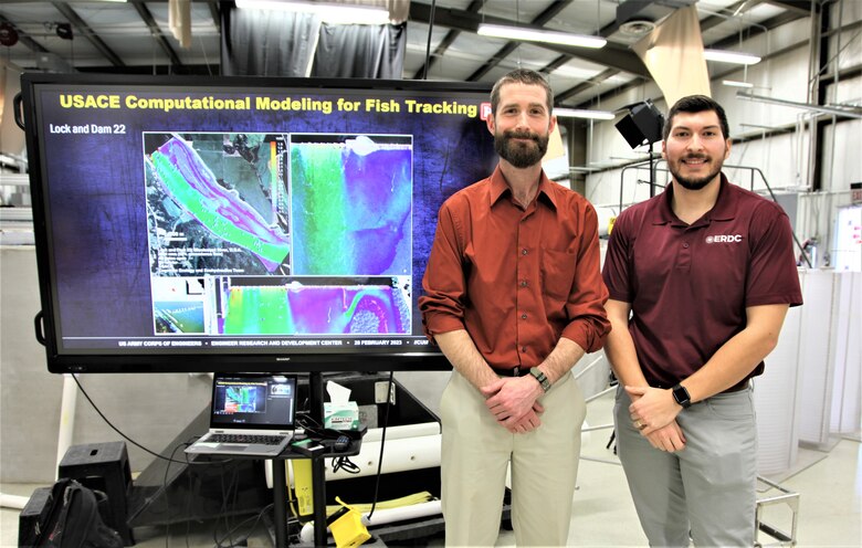 During his orientation tour of four U.S. Army Engineer Research and Development Center laboratories, Portland District’s Dr. Kyle Tidwell, left, visited the Environmental Laboratory’s (EL) Cognitive Ecology Ecohydraulics Research Facility for a briefing by the lab’s Avery Schemmel, research engineer, right, on Computational Modeling for Fish Tracking. Tidwell’s ERDC-U project of researching how civil work programs can support endangered salmon recovery in the Columbia River is based at this EL facility.