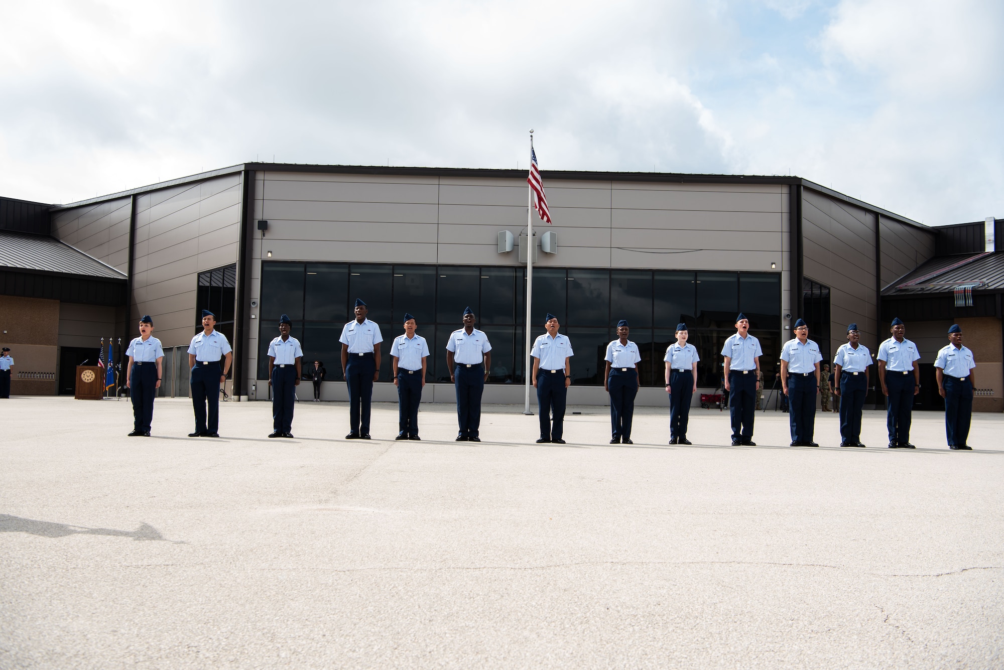 New graduates recite the Airmen’s Creed at Basic Military Training during the Coin Ceremony at JBSA-Lackland, April 26, 2023. The 14 Airmen became the first U.S. citizens here under the new streamlined Naturalization Process at BMT. The Airmen were part of approximately 500 trainees from the 326th Training Squadron who graduated this week. The process is part of an effort to revive the naturalization path for immigrants and allow trainees to become citizens before they graduate. It’s just one of several initiatives the Air Force is taking to remove barriers to service amid the current challenging recruiting environment. (U.S. Air Force photo by Vanessa R. Adame)