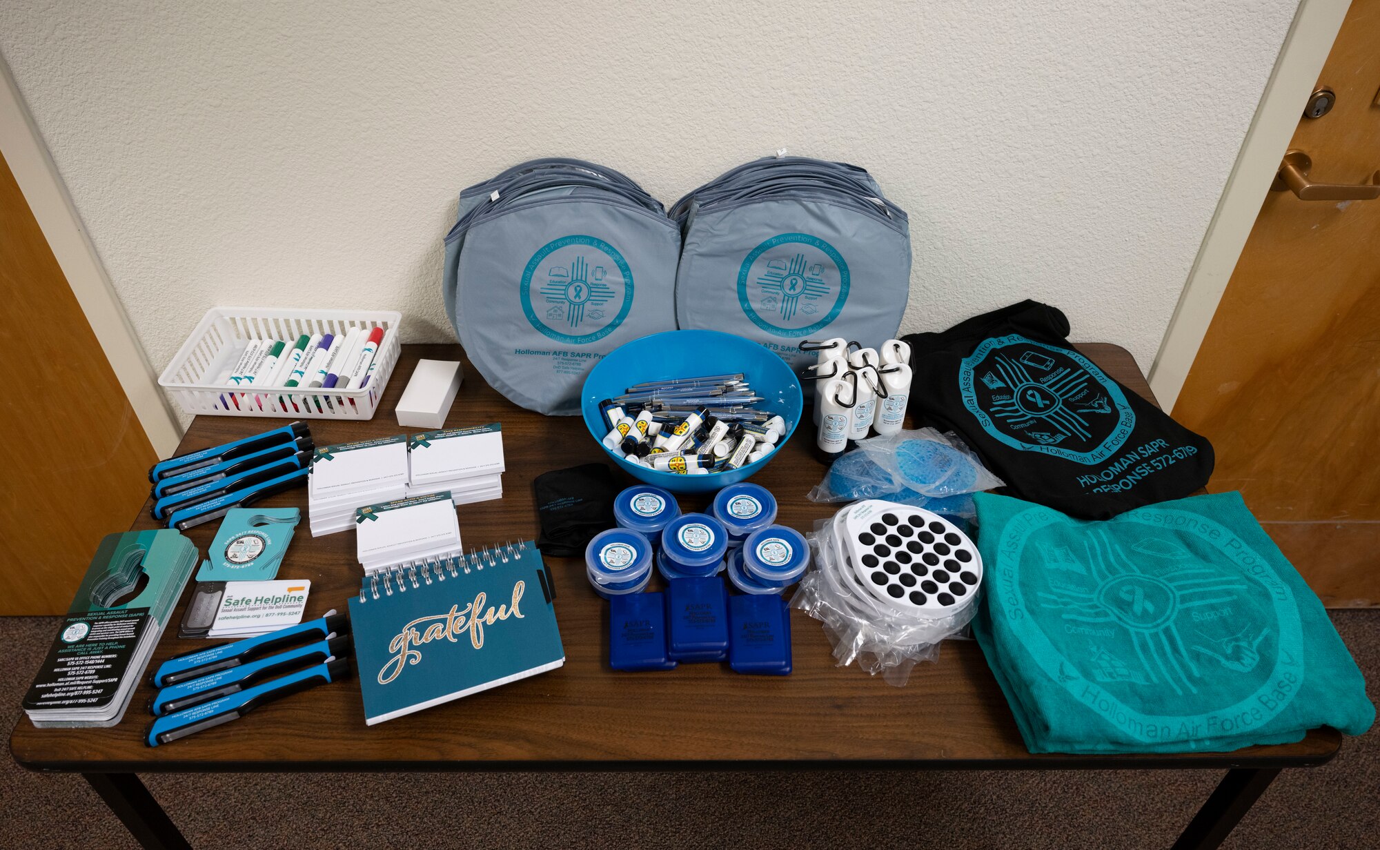 The Sexual Assault Prevention and Response office displays giveaway items outside the door at Holloman Air Force Base, New Mexico, April 26, 2023. SAPR promotional items are free and are a popular way for members to increase awareness. (U.S. Air Force photo by Airman 1st Class Michelle Ferrari)