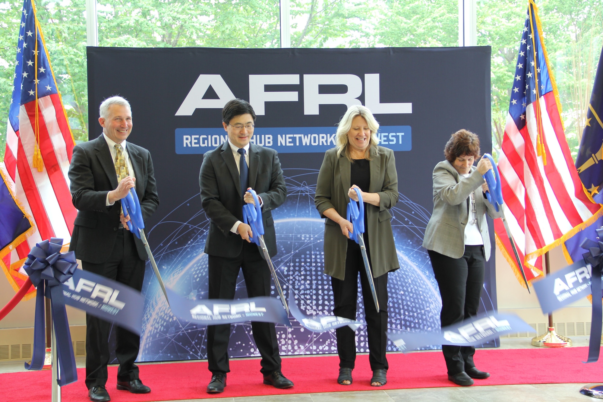 From left: Dr. Richard Vaia, chief scientist, Materials and Manufacturing Directorate at Air Force Research Laboratory, or AFRL; Mung Chiang, president, Purdue University; Monica Poelking, deputy chief technology officer at AFRL; and Dr. Karen Plaut, principal investigator, AFRL Regional Network Hub-Midwest, cut the ribbon during an opening ceremony for the partnership between AFRL and Purdue University to kick off the Regional Network Hub-Midwest April 21, 2023, at Purdue University in West Lafayette, Indiana. (U.S. Air Force photo / Aleah M. Castrejon)