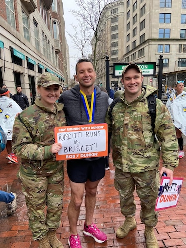 Image of Boston Marathon runner with Airmen