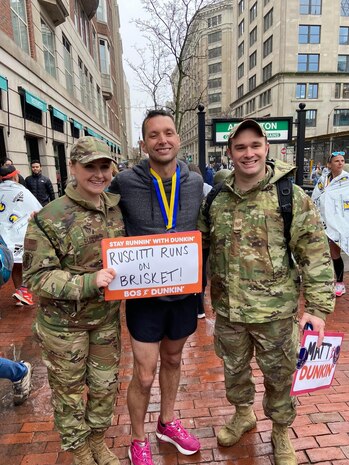 Image of Boston Marathon runner with Airmen