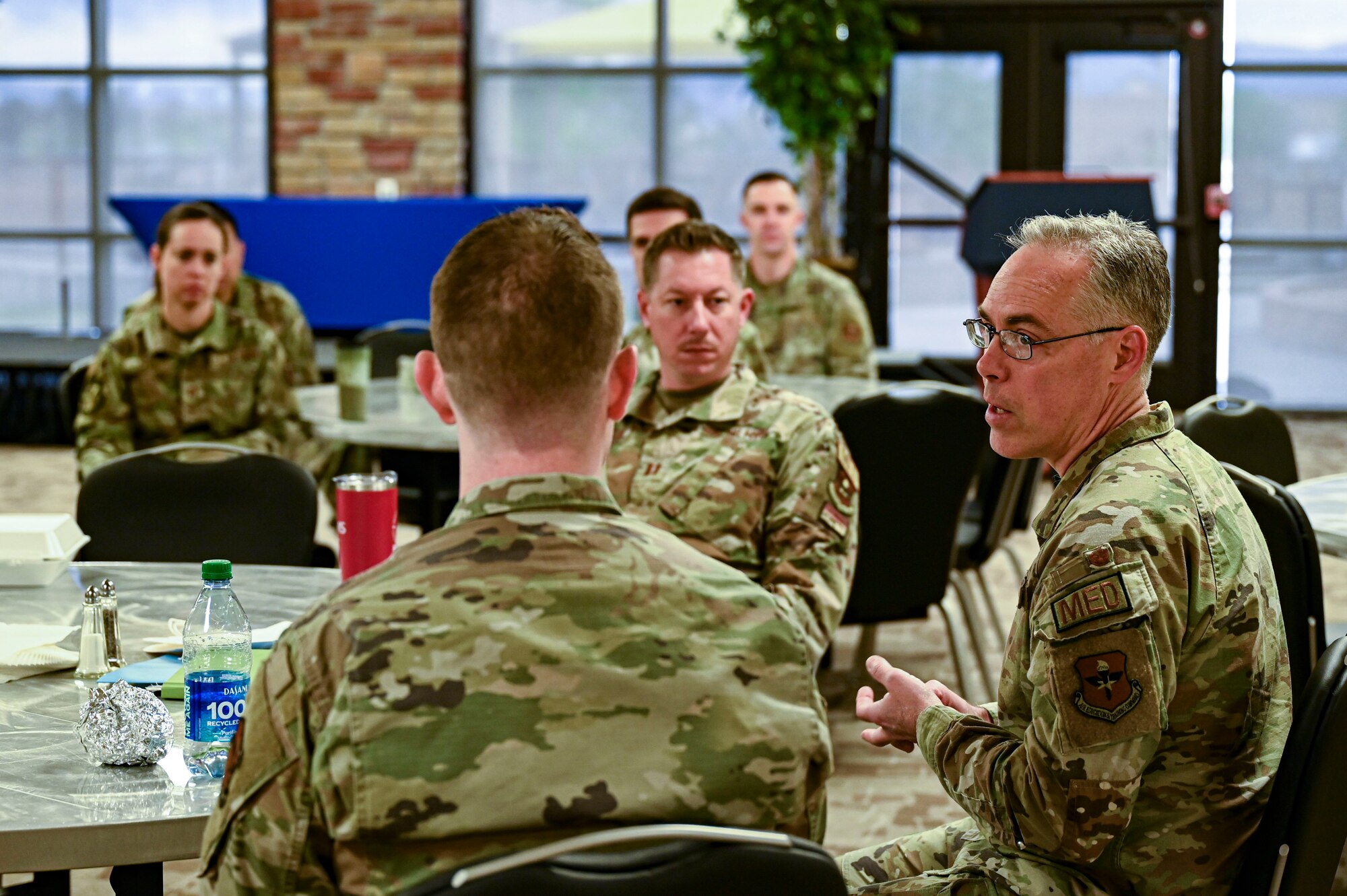 U.S. Air Force Col. Christopher Grussendorf, right, Air Education and Training Command surgeon general, speaks to staff members from the 49th Medical Group at Holloman Air Force Base, New Mexico, April 13, 2023. The 49th MDG provides quality care to more than 14,000 beneficiaries in the surrounding area provided by a team of both civilians and service members employed at the clinic. (U.S. Air Force photo by Airman 1st Class Isaiah Pedrazzini)