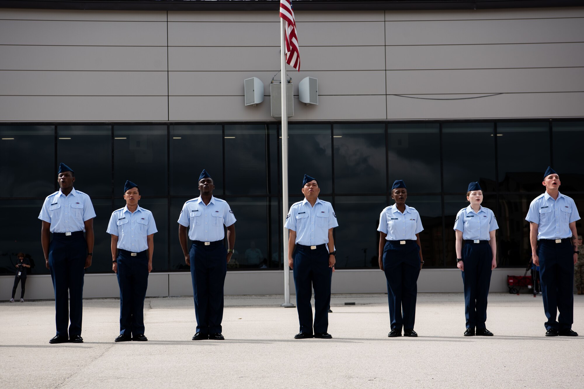 New graduates recite the Airmen’s Creed at Basic Military Training during the Coin Ceremony at JBSA-Lackland, April 26, 2023. Fourteen Airmen became the first U.S. citizens here under the new streamlined Naturalization Process at BMT. The Airmen were part of approximately 500 trainees from the 326th Training Squadron who graduated this week. The process is part of an effort to revive the naturalization path for immigrants and allow trainees to become citizens before they graduate. It’s just one of several initiatives the Air Force is taking to remove barriers to service amid the current challenging recruiting environment. (U.S. Air Force photo by Vanessa R. Adame)