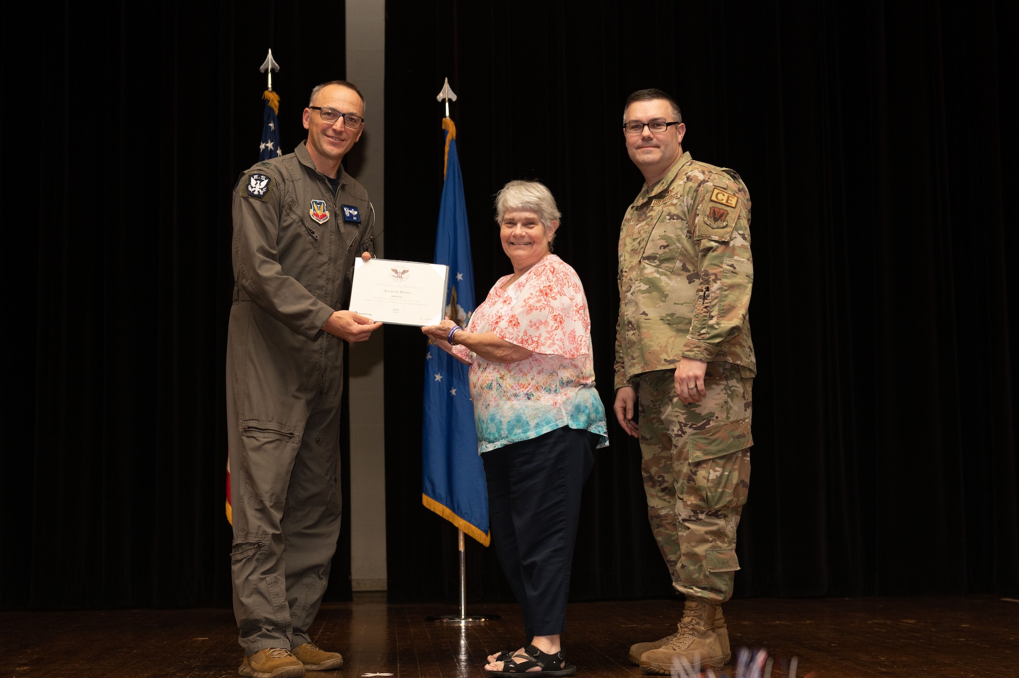 Col. Steven Bofferding, left, 4th Fighter Wing vice commander, and Chief Master Sgt. Kyle O’Hara, right, 4th Civil Engineer Squadron command chief, present the Bronze Presidential Volunteer Service Award to a Seymour Johnson Air Force Base volunteer during a volunteer appreciation ceremony at Seymour Johnson Air Force Base, North Carolina, April 21, 2023. The Bronze award winners have completed 100 to 174 hours for young adults, 100 to 249 hours for adults and 200 to 499 for families and groups. (U.S. Air Force photo by Airman 1st Class Rebecca Sirimarco-Lang)