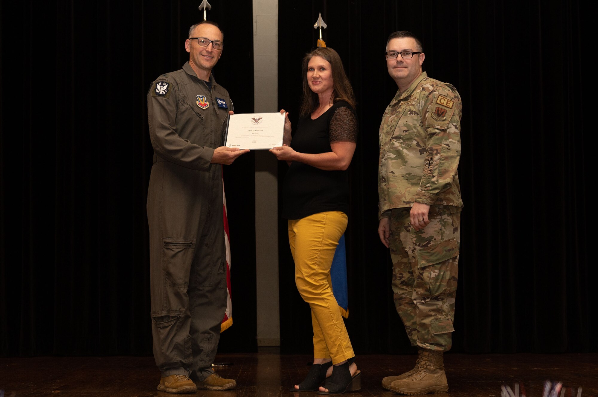 Col. Steven Bofferding, left, 4th Fighter Wing vice commander, and Chief Master Sgt. Kyle O’Hara, right, 4th Civil Engineer Squadron command chief, present the Bronze Presidential Volunteer Service Award to a Seymour Johnson Air Force Base volunteer during a volunteer appreciation ceremony at Seymour Johnson Air Force Base, North Carolina, April 21, 2023. The Bronze award winners have completed 100 to 174 hours for young adults, 100 to 249 hours for adults and 200 to 499 for families and groups. (U.S. Air Force photo by Airman 1st Class Rebecca Sirimarco-Lang)