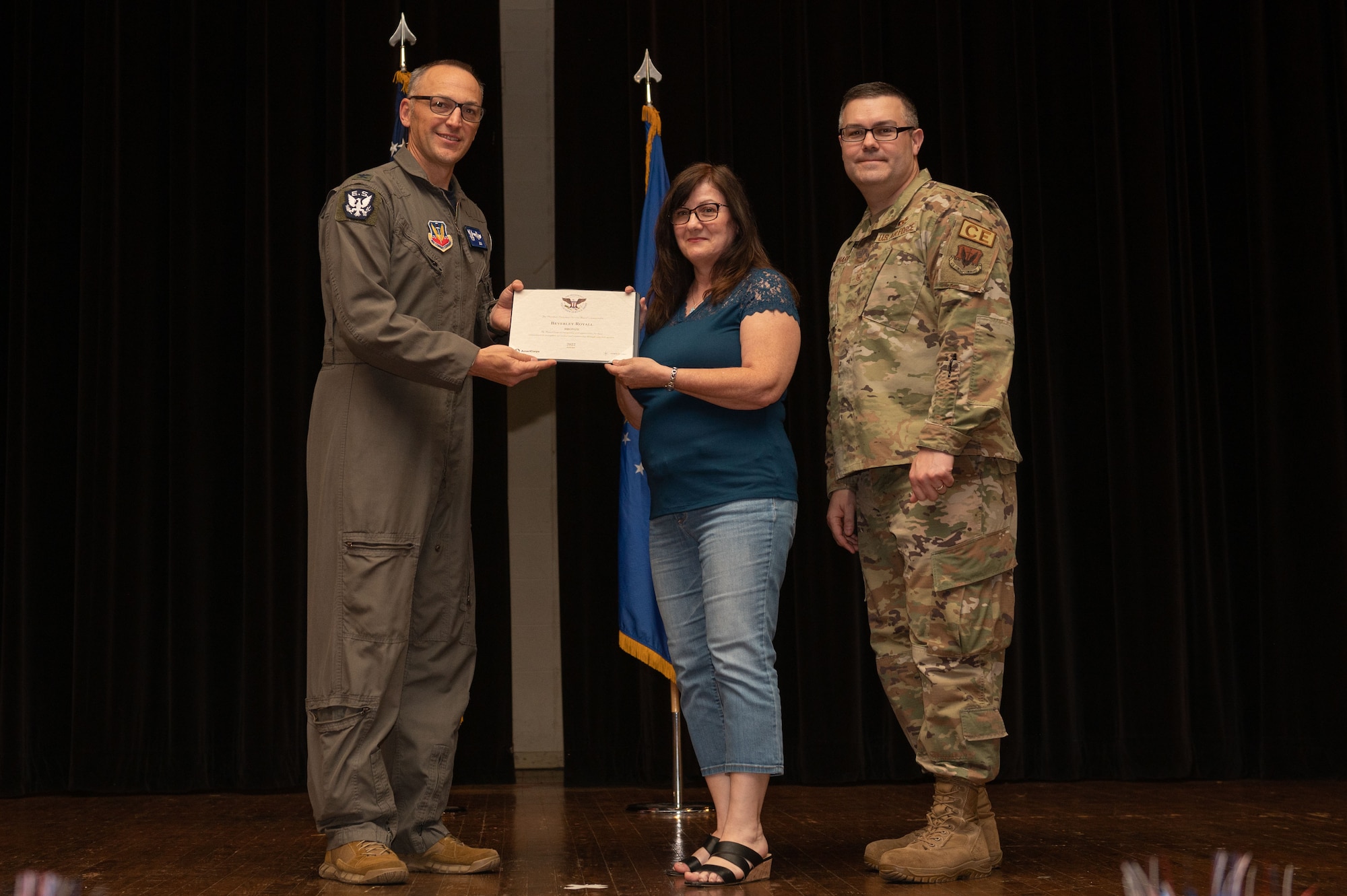 Col. Steven Bofferding, left, 4th Fighter Wing vice commander, and Chief Master Sgt. Kyle O’Hara, right, 4th Civil Engineer Squadron command chief, present the Bronze Presidential Volunteer Service Award to a Seymour Johnson Air Force Base volunteer during a volunteer appreciation ceremony at Seymour Johnson Air Force Base, North Carolina, April 21, 2023. The Bronze award winners have completed 100 to 174 hours for young adults, 100 to 249 hours for adults and 200 to 499 for families and groups. (U.S. Air Force photo by Airman 1st Class Rebecca Sirimarco-Lang)