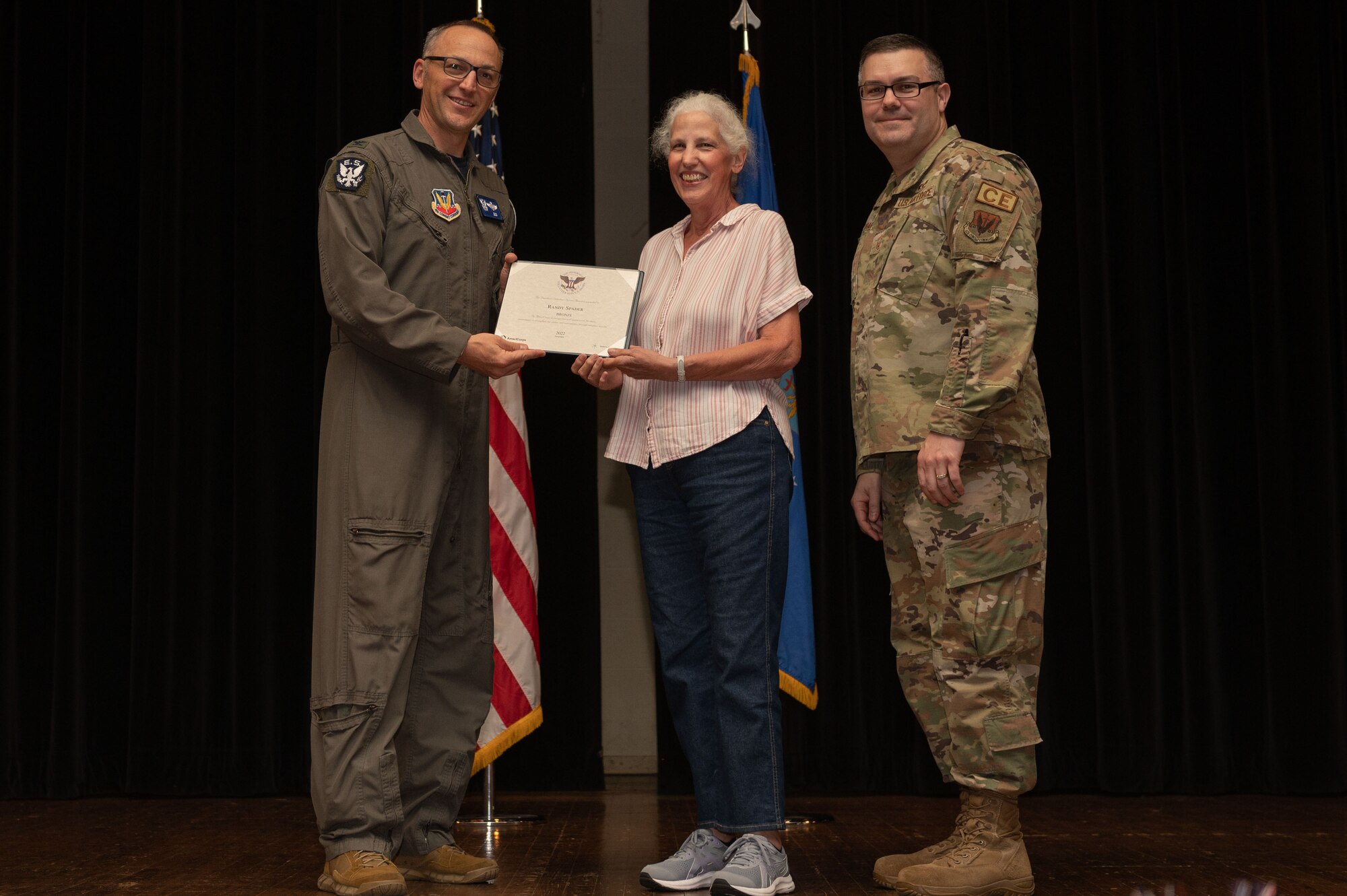 Col. Steven Bofferding, left, 4th Fighter Wing vice commander, and Chief Master Sgt. Kyle O’Hara, right, 4th Civil Engineer Squadron command chief, present the Bronze Presidential Volunteer Service Award to a Seymour Johnson Air Force Base volunteer during a volunteer appreciation ceremony at Seymour Johnson Air Force Base, North Carolina, April 21, 2023. The Bronze award winners have completed 100 to 174 hours for young adults, 100 to 249 hours for adults and 200 to 499 for families and groups. (U.S. Air Force photo by Airman 1st Class Rebecca Sirimarco-Lang)