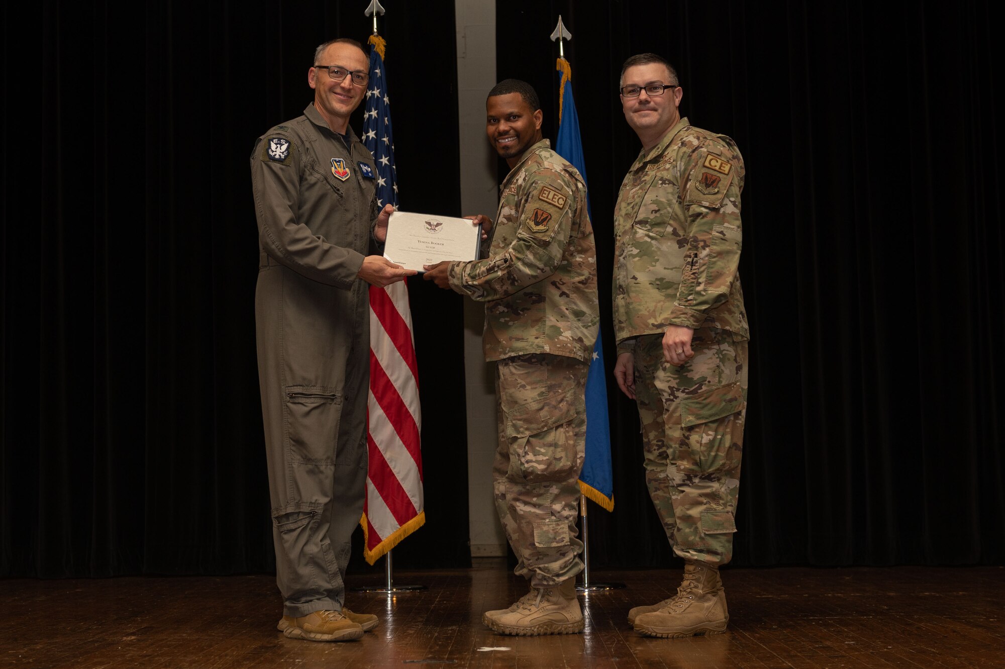 Col. Steven Bofferding, left, 4th Fighter Wing vice commander, and Chief Master Sgt. Kyle O’Hara, right, 4th Civil Engineer Squadron command chief, present the Bronze Presidential Volunteer Service Award to a Seymour Johnson Air Force Base volunteer during a volunteer appreciation ceremony at Seymour Johnson Air Force Base, North Carolina, April 21, 2023. The Bronze award winners have completed 100 to 174 hours for young adults, 100 to 249 hours for adults and 200 to 499 for families and groups. (U.S. Air Force photo by Airman 1st Class Rebecca Sirimarco-Lang)