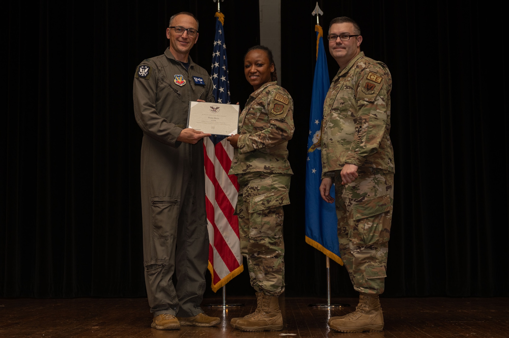 Col. Steven Bofferding, left, 4th Fighter Wing vice commander, and Chief Master Sgt. Kyle O’Hara, right, 4th Civil Engineer Squadron command chief, present the Bronze Presidential Volunteer Service Award to a Seymour Johnson Air Force Base volunteer during a volunteer appreciation ceremony at Seymour Johnson Air Force Base, North Carolina, April 21, 2023. The Bronze award winners have completed 100 to 174 hours for young adults, 100 to 249 hours for adults and 200 to 499 for families and groups. (U.S. Air Force photo by Airman 1st Class Rebecca Sirimarco-Lang)