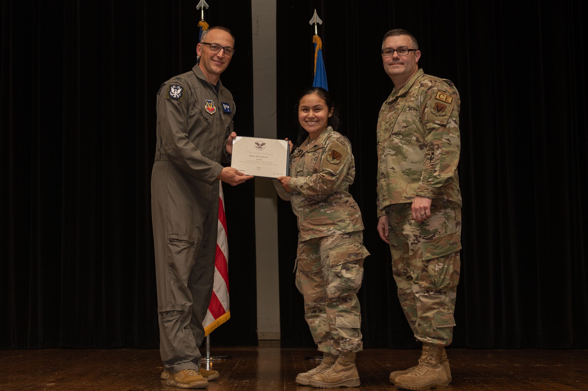 Col. Steven Bofferding, left, 4th Fighter Wing vice commander, and Chief Master Sgt. Kyle O’Hara, right, 4th Civil Engineer Squadron command chief, present the Bronze Presidential Volunteer Service Award to a Seymour Johnson Air Force Base volunteer during a volunteer appreciation ceremony at Seymour Johnson Air Force Base, North Carolina, April 21, 2023. The Bronze award winners have completed 100 to 174 hours for young adults, 100 to 249 hours for adults and 200 to 499 for families and groups. (U.S. Air Force photo by Airman 1st Class Rebecca Sirimarco-Lang)