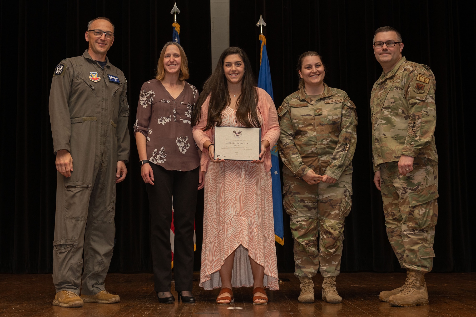 Col. Steven Bofferding, left, 4th Fighter Wing vice commander, and Chief Master Sgt. Kyle O’Hara, right, 4th Civil Engineer Squadron command chief, present the Bronze Presidential Volunteer Service Award to a Seymour Johnson Air Force Base volunteers during a volunteer appreciation ceremony at Seymour Johnson Air Force Base, North Carolina, April 21, 2023. The Bronze award winners have completed 100 to 174 hours for young adults, 100 to 249 hours for adults and 200 to 499 for families and groups. (U.S. Air Force photo by Airman 1st Class Rebecca Sirimarco-Lang)