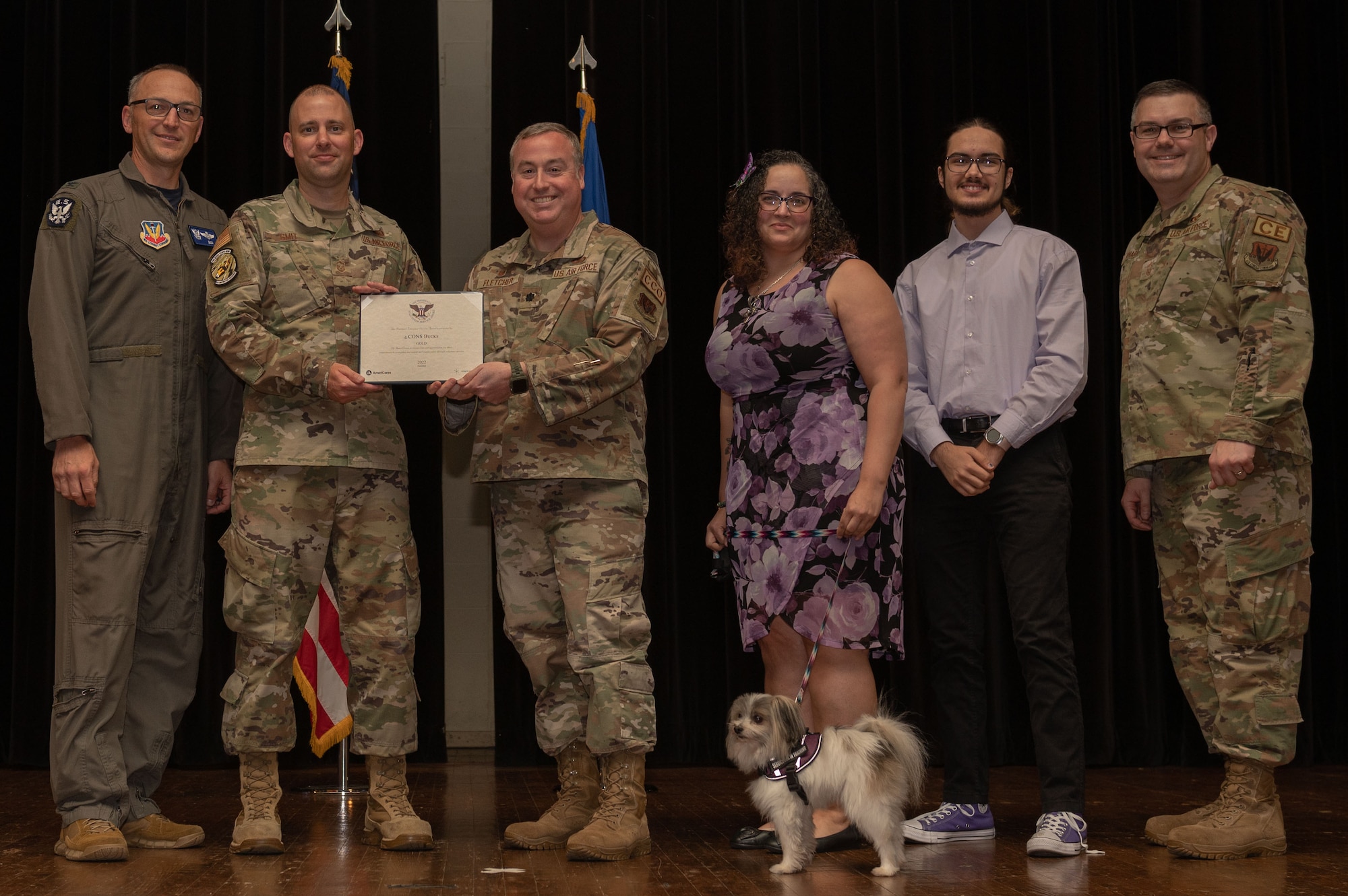 Col. Steven Bofferding, left, 4th Fighter Wing vice commander, and Chief Master Sgt. Kyle O’Hara, right, 4th Civil Engineer Squadron command chief, present the Gold Presidential Volunteer Service Award to a Seymour Johnson Air Force Base volunteers during a volunteer appreciation ceremony at Seymour Johnson Air Force Base, North Carolina, April 21, 2023. The Gold award winners have completed 250 or more hours for young adults, 500 or more hours for adults and 1000 or more hours for families and groups. (U.S. Air Force photo by Airman 1st Class Rebecca Sirimarco-Lang)