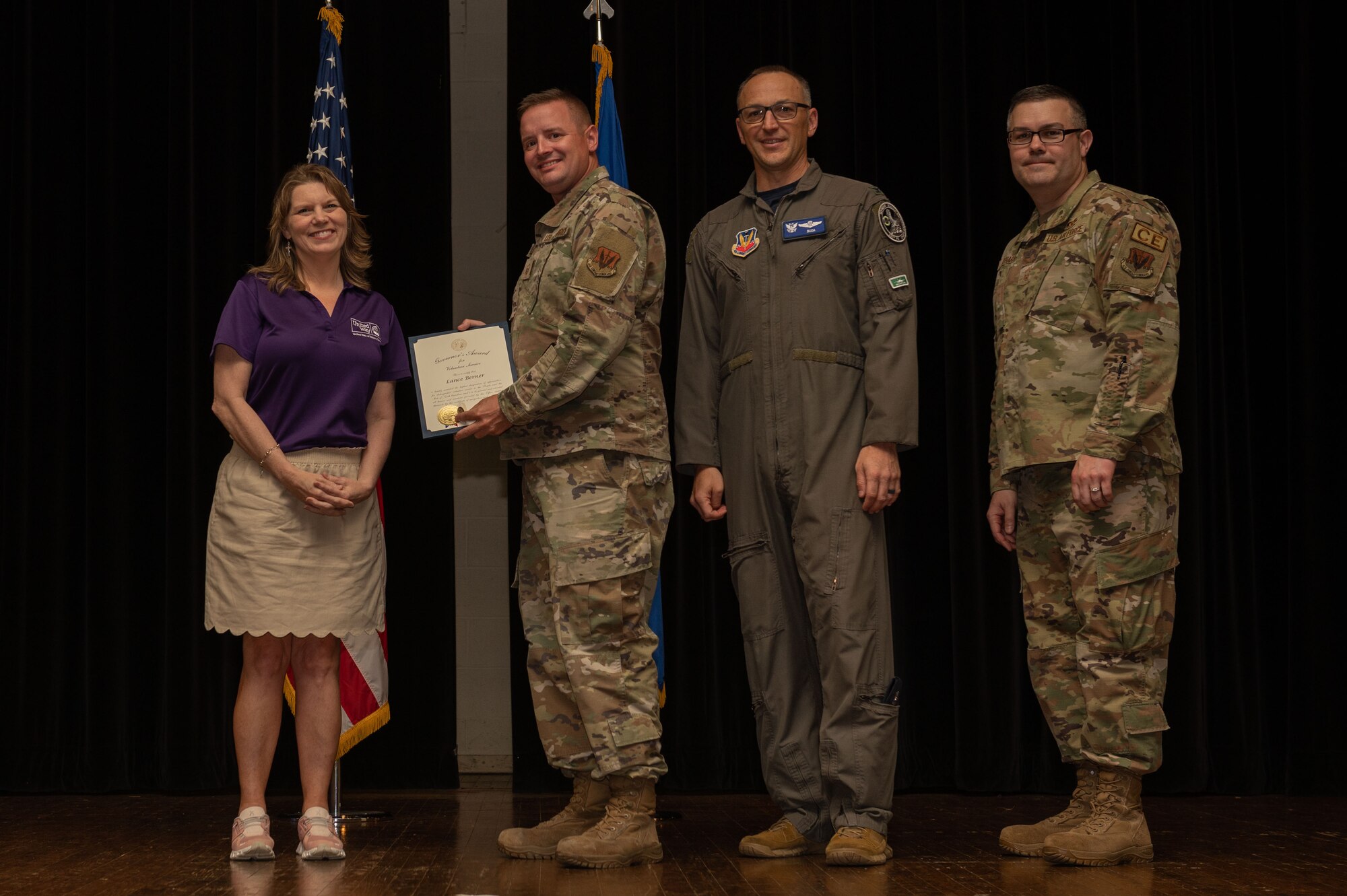Col. Steven Bofferding, 4th Fighter Wing vice commander, Chief Master Sgt. Kyle O’Hara, right, 4th Civil Engineer Squadron command chief, and Sherry Archibald, left, United Way executive director, present the North Carolina Governor’s Volunteer Service Award to Master Sgt. Lance Berner, 4th Logistics Readiness Squadron non-commissioned officer in charge, during a volunteer appreciation ceremony at Seymour Johnson Air Force Base, North Carolina, April 21, 2023. This award honors the true spirit of volunteerism by recognizing individuals, groups and businesses that make a significant contribution to their community through volunteer service. (U.S. Air Force photo by Airman 1st Class Rebecca Sirimarco-Lang)