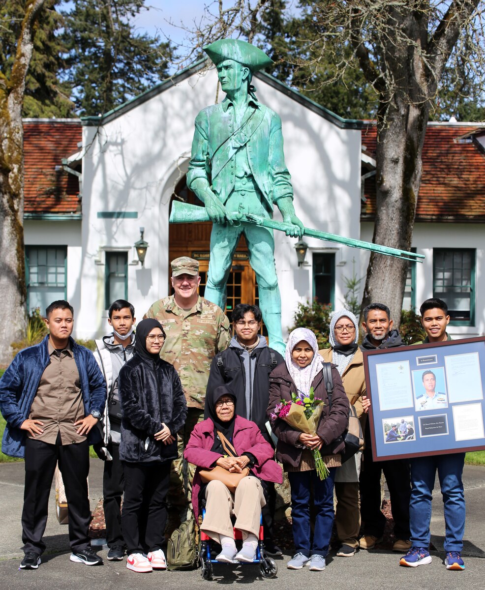 Brig. Gen. Gent Welsh, commander of the Washington Air National Guard, with the family of the late Col. Hasnol Hisham Abu Hassan, Royal Malaysian Air Force, during a visit to Washington April 25, 2023 ,at Camp Murray, Wash.