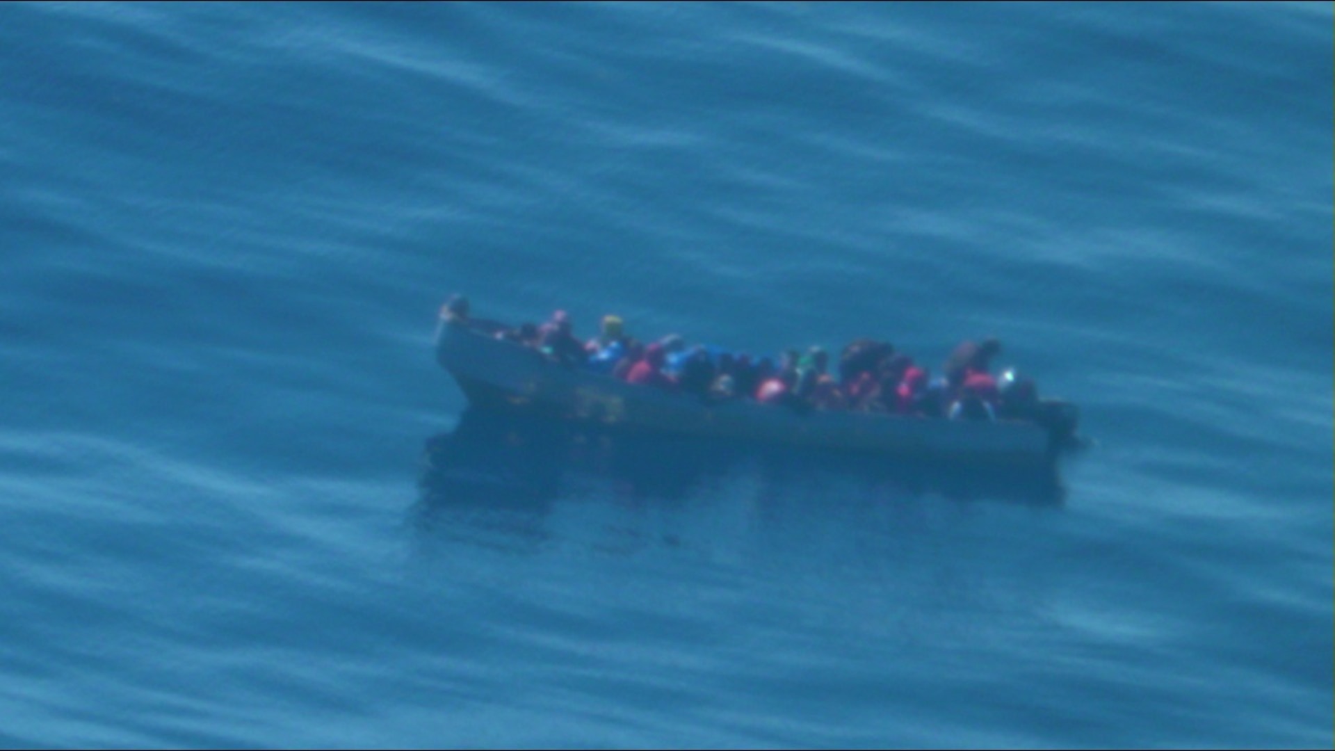 Coast Guard Cutter Richard Dixon interdicts an overloaded makeshift vessel in Mona Passage waters April 15, 2023. The cutter crew safely embarked and returned 34 migrants from this voyage to authorities in the Dominican Republic April 27, 2023.  (U.S. Coast Guard photo)