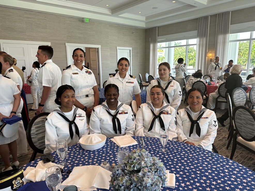 230426-N-ZK609-0004 Fort Lauderdale, Fla. (April 26, 2023). Members of the USS Cole (DDG-67) pose for a picture during the Salute to Women in the Military luncheon during Fleet Week Port Everglades. This luncheon has been an annual event on the Fleet Week Port Everglades schedule since 2017. (Photo by Navy Region Southeast Public Affairs Specialist Twilla Burns/released).