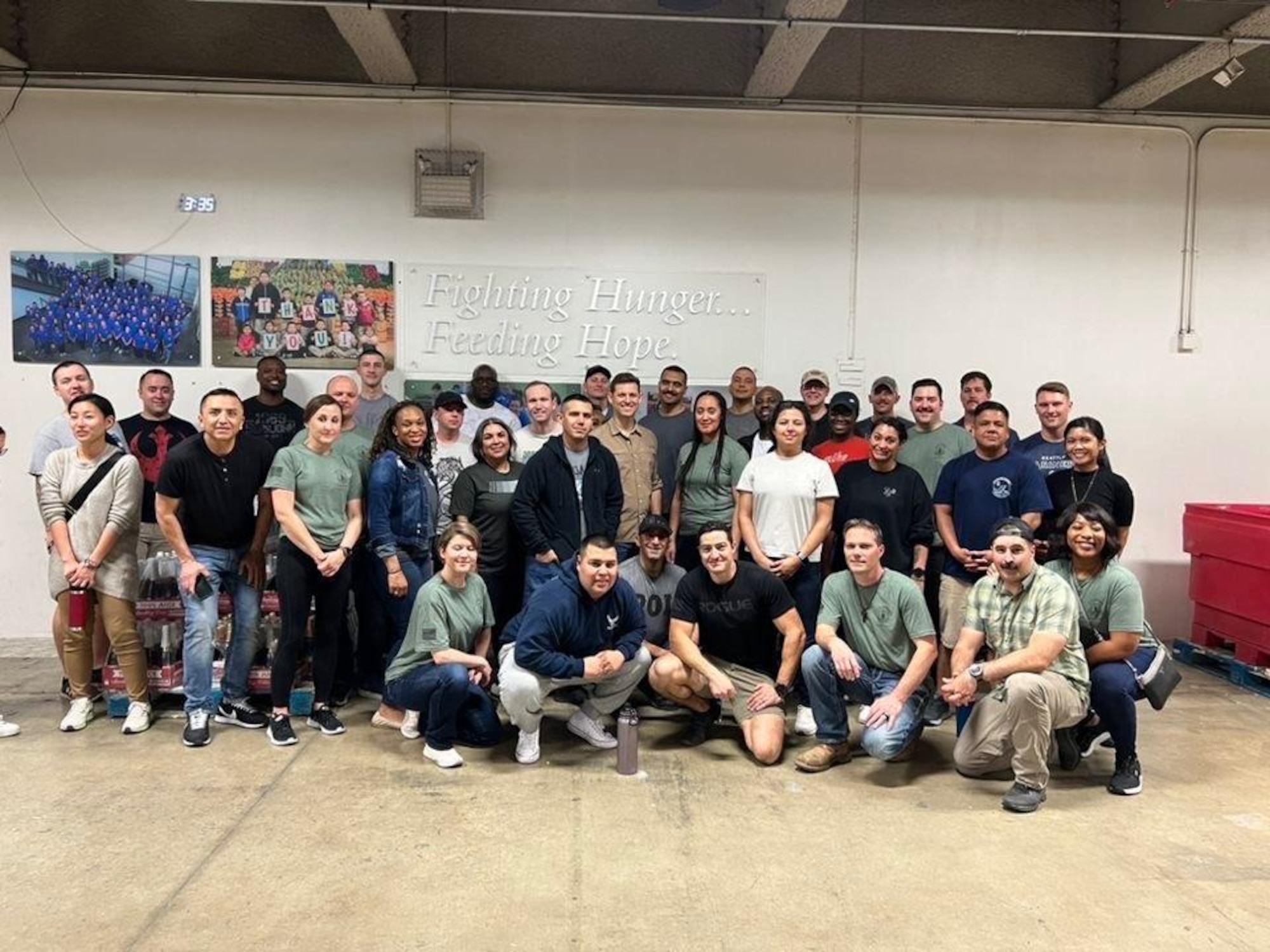 The student airmen and host members pose for a photo after the volunteer event at the San Antonio Food Bank on March 30, 2023. (Courtesy photo)