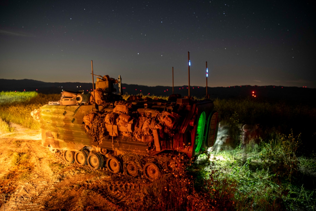 An U.S. Marine Corps A1 assault amphibious vehicle assigned to Charlie Company, 3rd Assault Amphibian Battalion, 1st Marine Division, is staged on a hill before a simulated raid during 1/5’s MCCRE at Marine Corps Base Camp Pendleton, April 20, 2023. The purpose of a MCCRE, is to formally evaluate the unit’s core and/or assigned mission essential tasks to ensure service standardization and combat readiness. (U.S. Marine Corps photo by Cpl. Patrick Katz) (This photo was taken using long exposure techniques in-camera on a Sony A7R 3.)